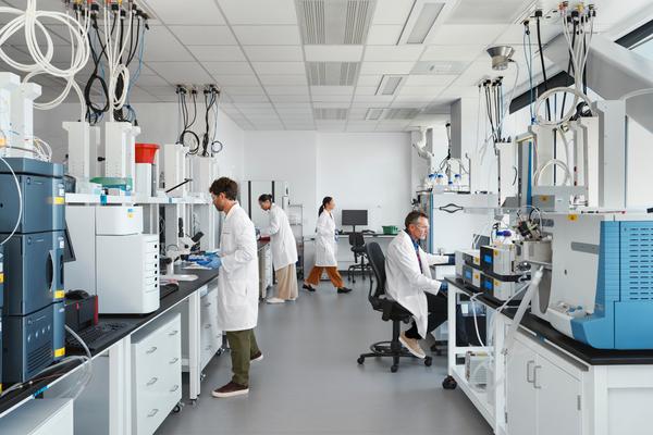 Researcher Image: A researcher using advanced technology in a lab to develop innovative treatments for multiple myeloma patients.